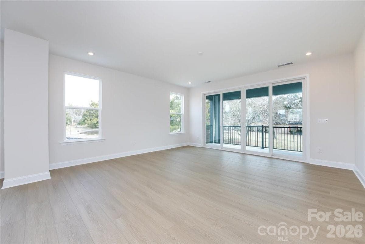 Great room with access to the covered outdoor living - Charlotte