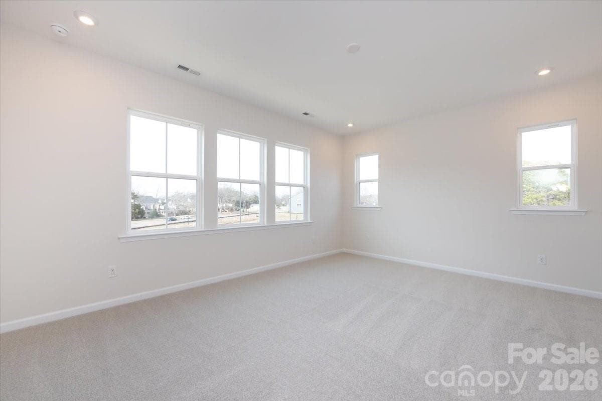 Light filled primary bedroom - Charlotte