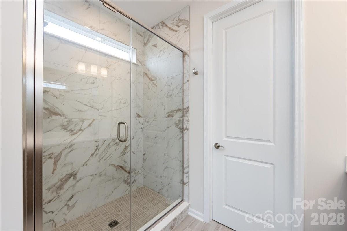 Tiled primary walk-in shower - Charlotte
