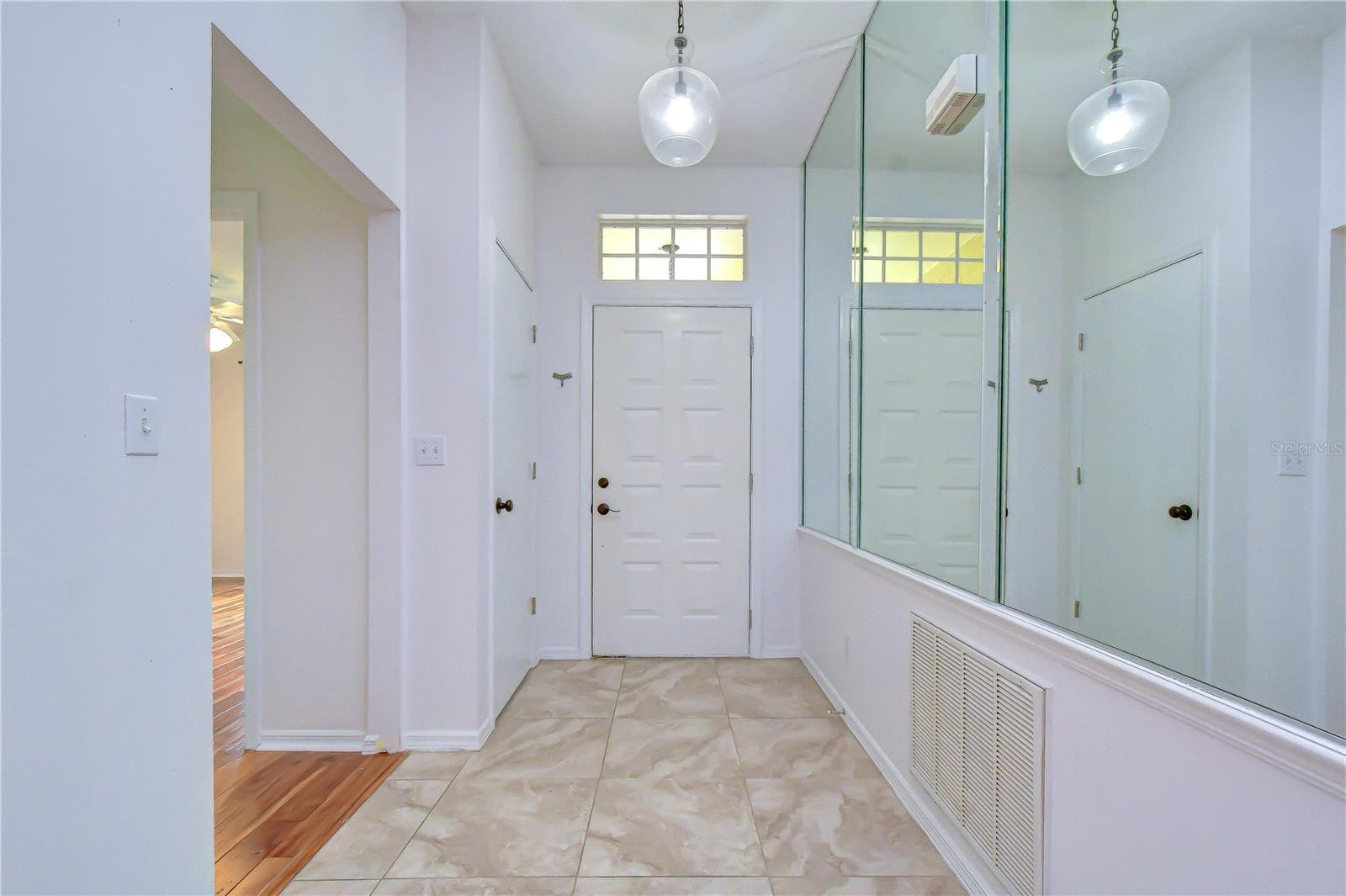Welcoming entrance leading into bright, open living spaces. - 818 MCCALLISTER AVE, SUN CITY CENTER