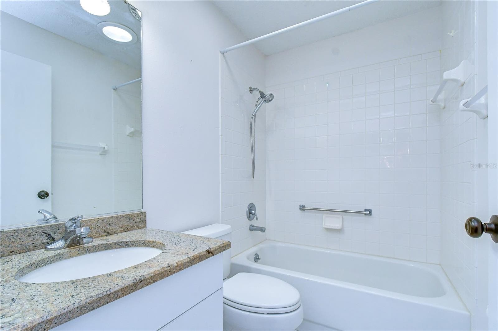 Well-appointed secondary bathroom conveniently serving guests. - 818 MCCALLISTER AVE, SUN CITY CENTER
