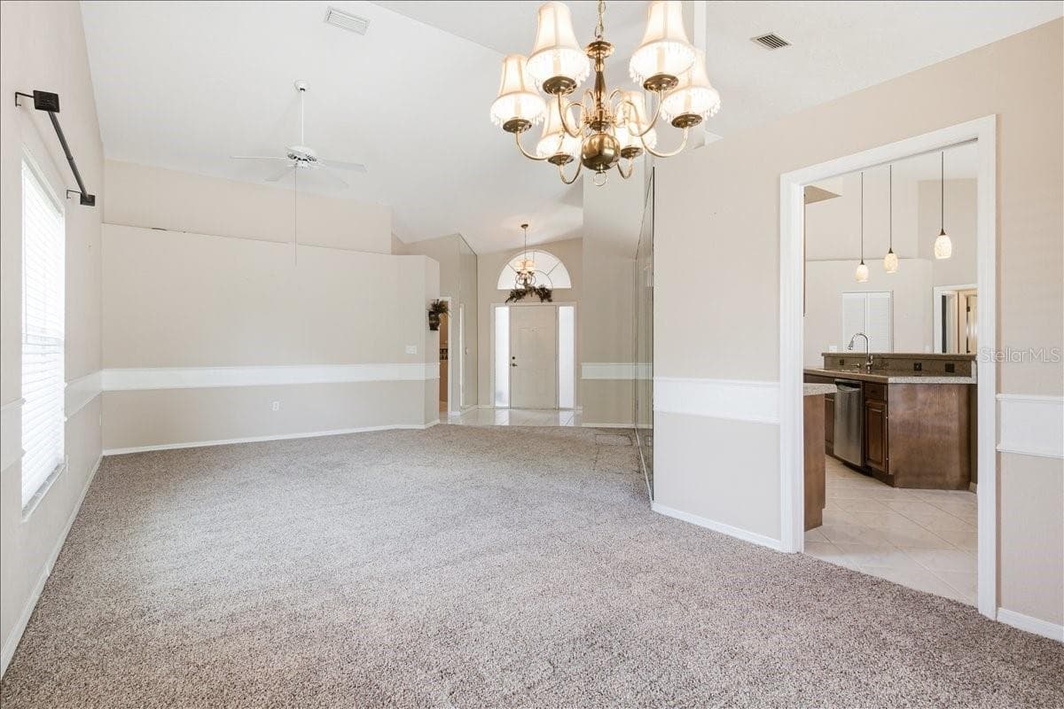 Reverse view from dining room through living room - 7015 PLEASANT HILL RD, BRADENTON