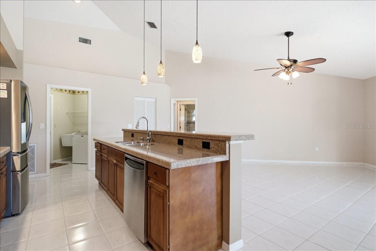 View from breakfast nook to kitchen and Den - 7015 PLEASANT HILL RD, BRADENTON