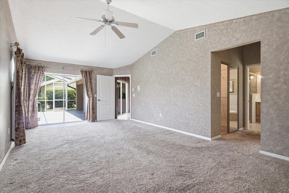 Primary bedroom also has sliders to lanai - 7015 PLEASANT HILL RD, BRADENTON