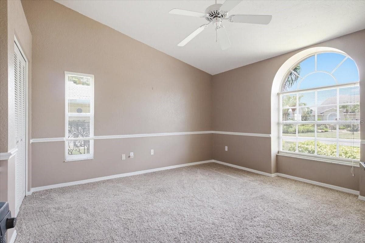 Bedroom three at front of home with South-facing view - 7015 PLEASANT HILL RD, BRADENTON