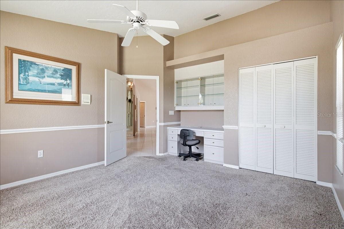 Bedroom three features built-in desk and storage - 7015 PLEASANT HILL RD, BRADENTON