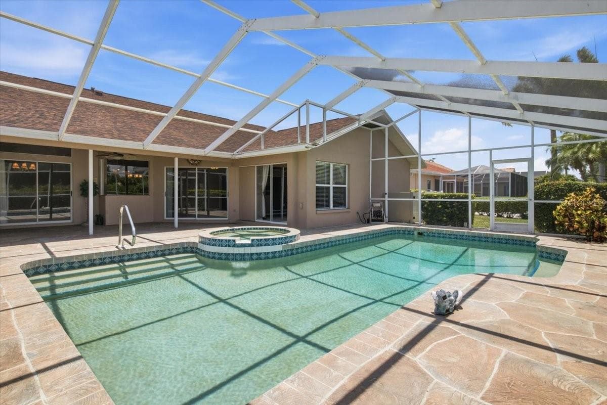 View of pool and lanai from golf course side - 7015 PLEASANT HILL RD, BRADENTON
