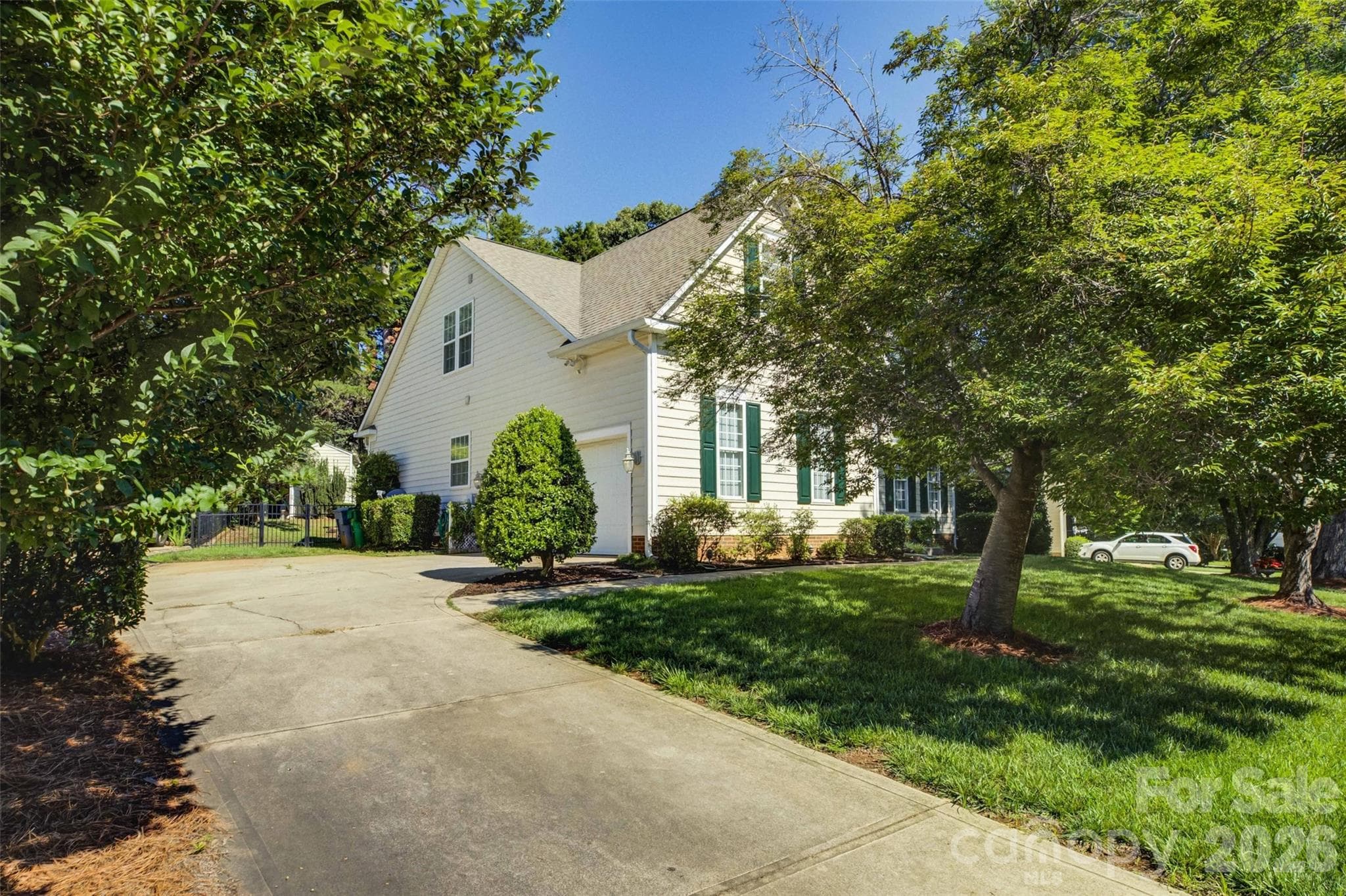 Side load 2-car garage and driveway. - 11611 Knightsdale Drive, Charlotte