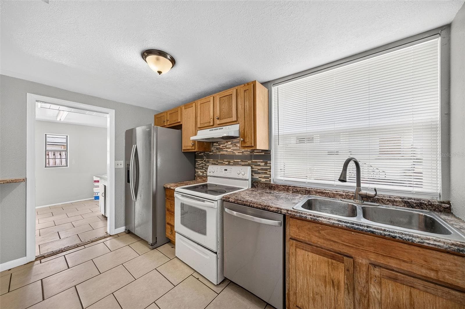 Unit 708 Kitchen/Laundry Room - 708 N SAINT CLAIR ABRAMS AVE, TAVARES