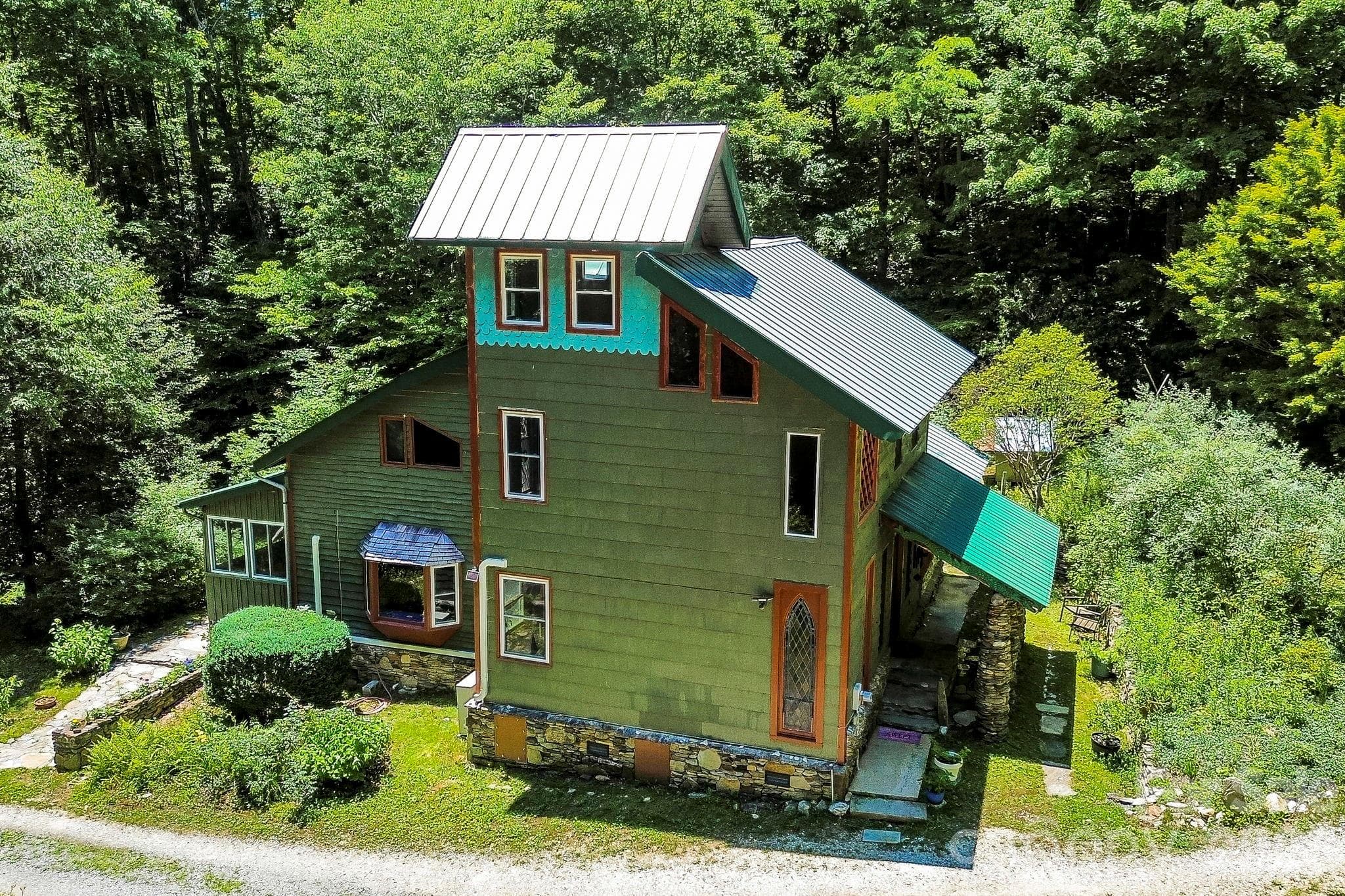 Aerial view shows the beauty and unique features of this home - Black Mountain