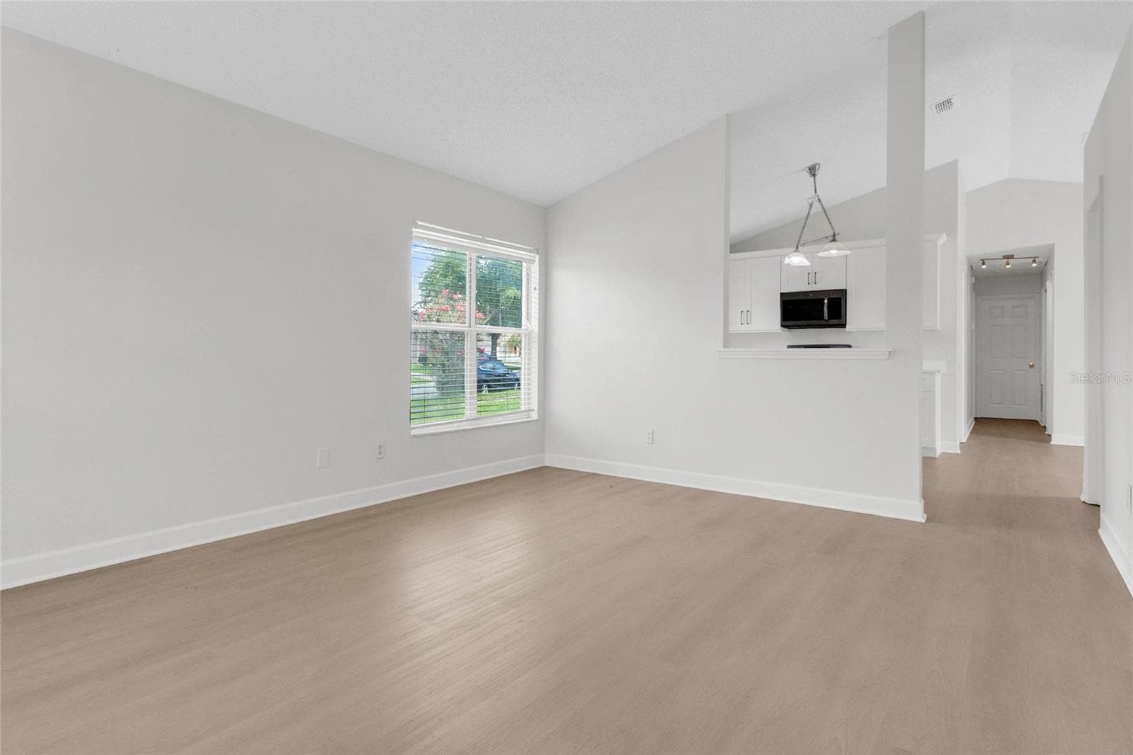 View from Front Entryway to Living Room & Kitchen - 9703 RED CLOVER AVE, ORLANDO
