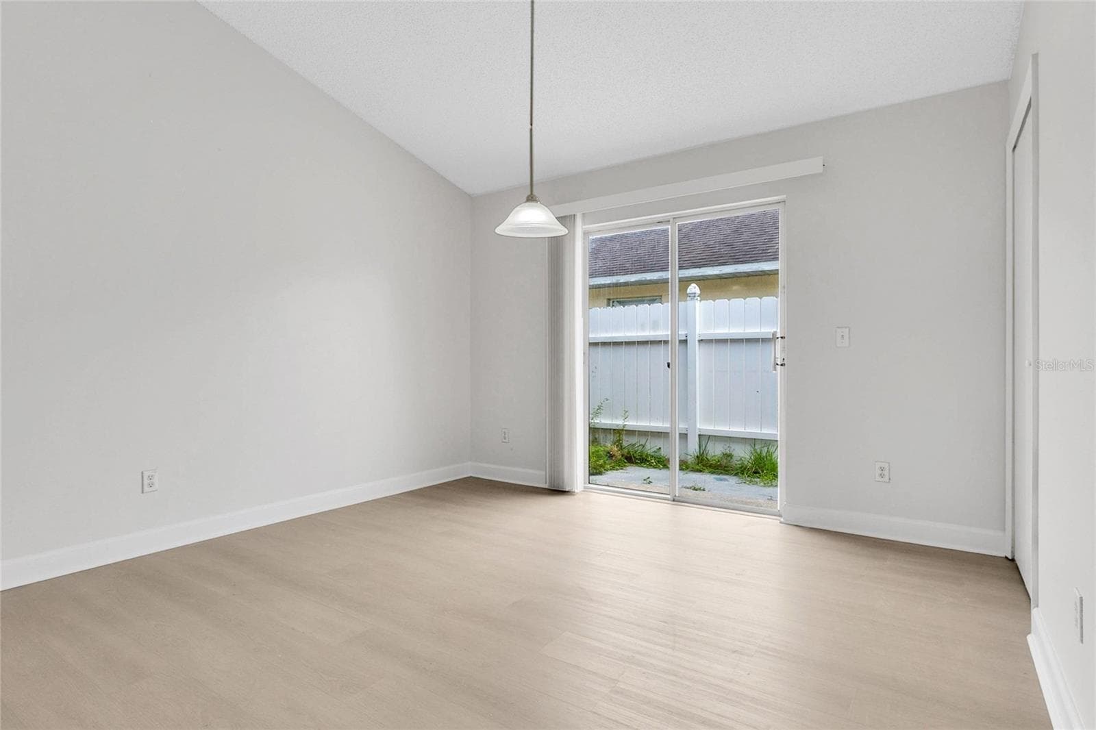 Dining Room & Sliding Glass Door to Exterior - 9703 RED CLOVER AVE, ORLANDO