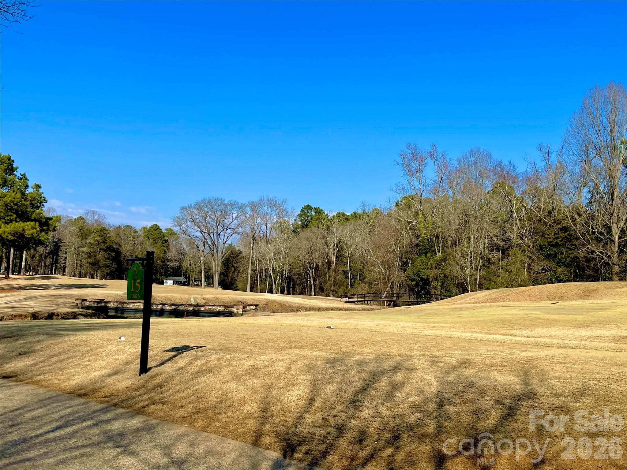 Lot in the background across fairway- Wooded area length of hole towards white building. - 330 Pinewood Lane, Rock Hill
