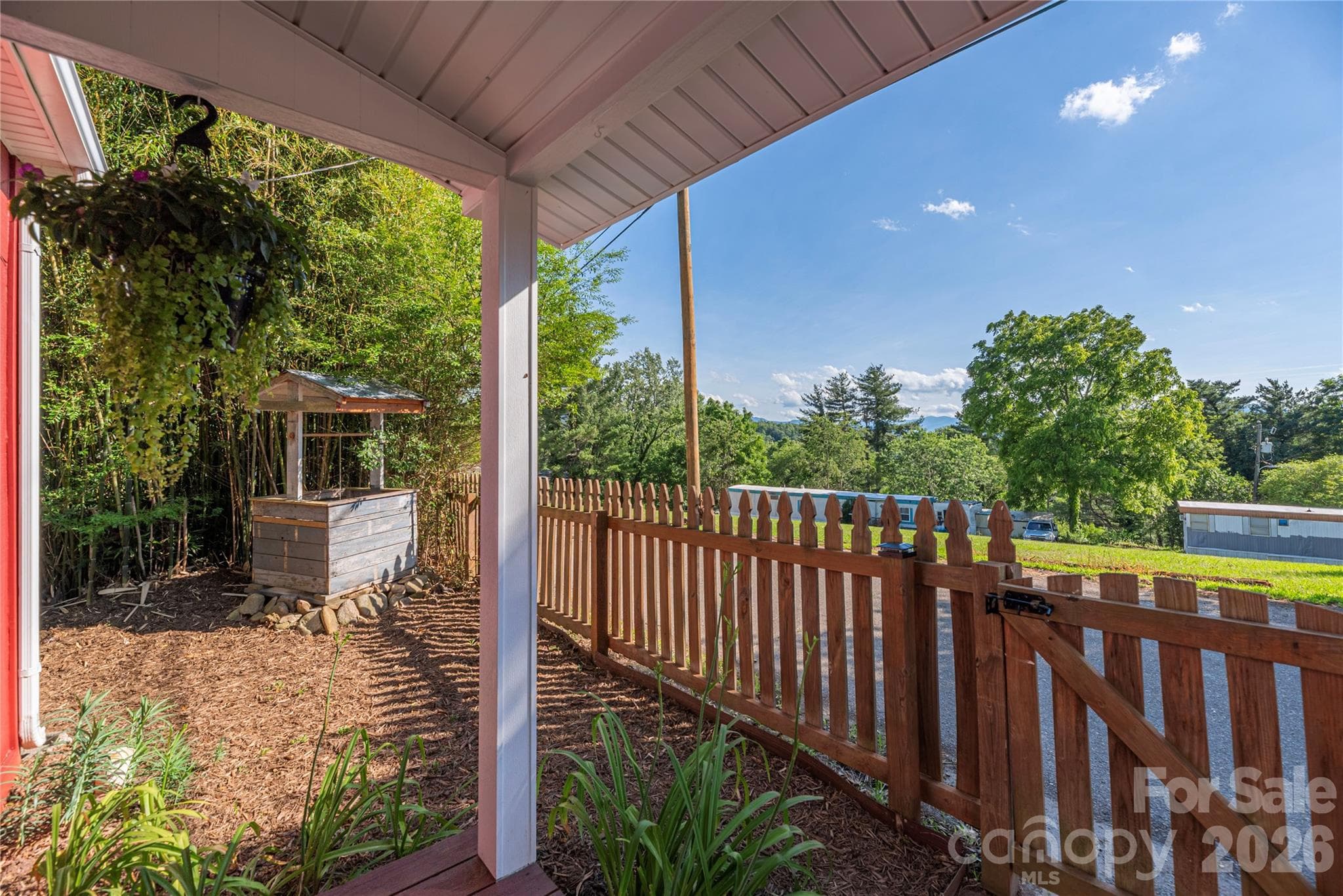 Enjoy mountain views and fresh air from the covered front porch. - 261 Star Ridge Road, Canton