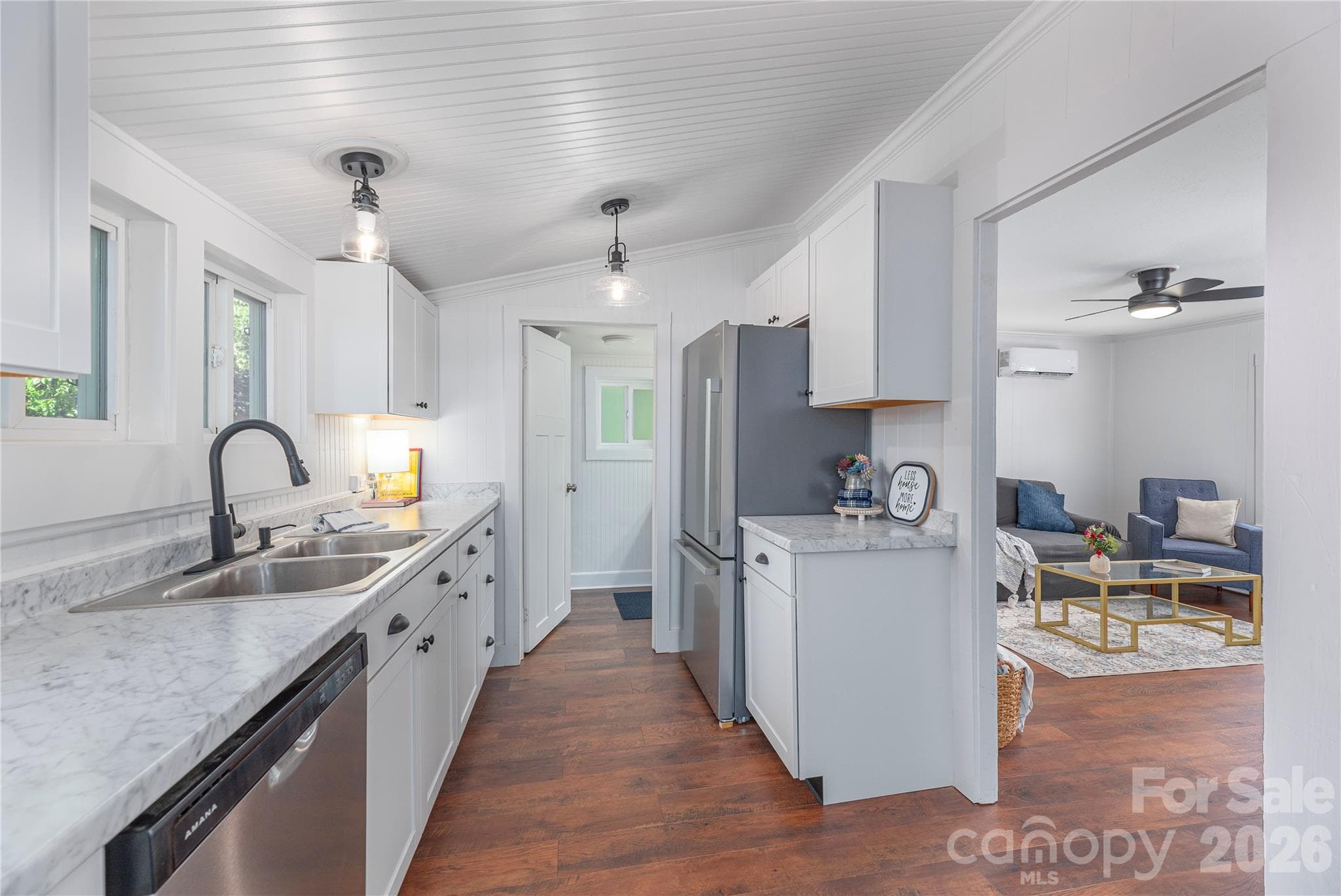 Updated kitchen with modern cabinetry, stainless appliances, and durable flooring. - Canton