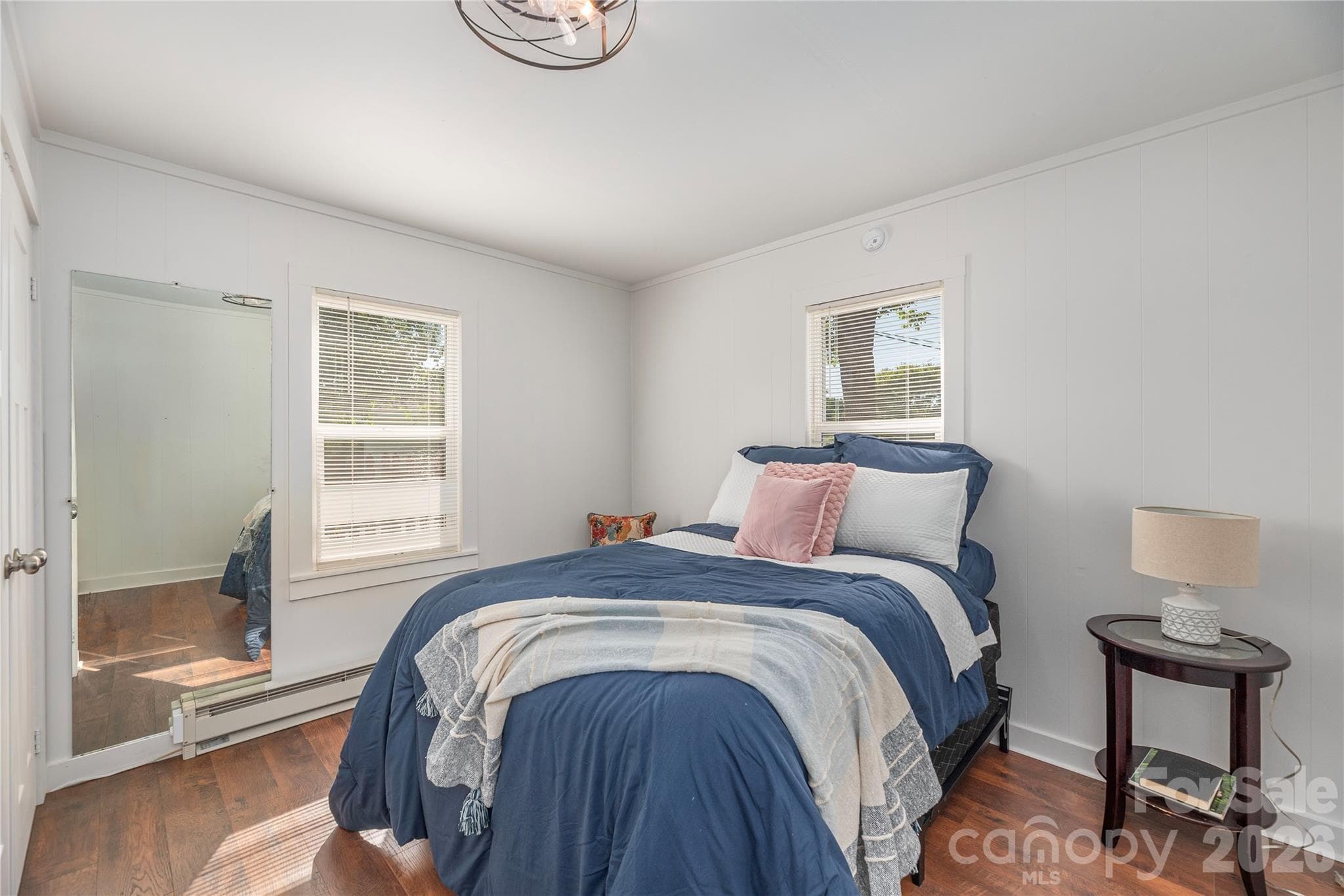 Bright bedroom with abundant natural light and updated flooring. - 261 Star Ridge Road, Canton
