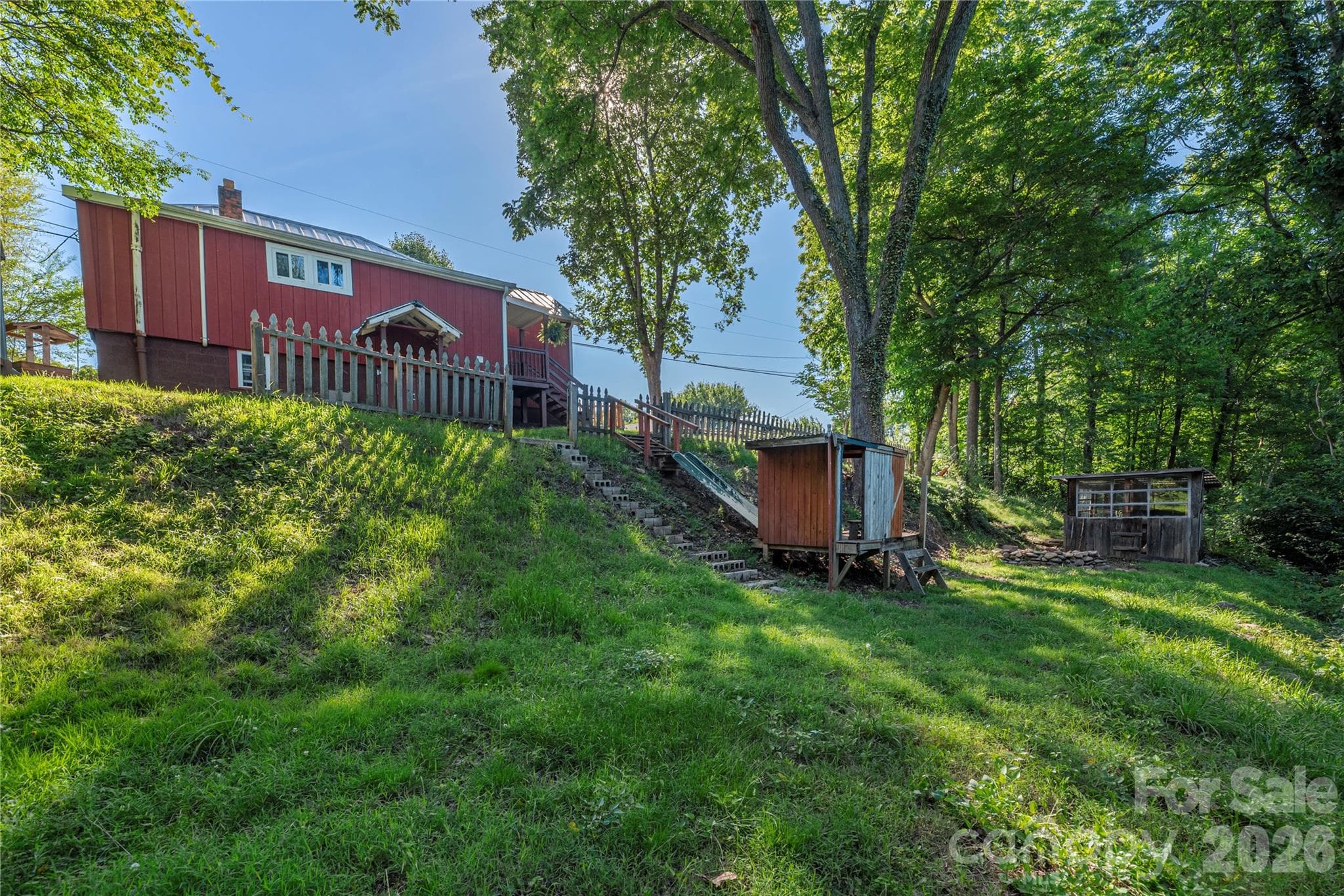 Backyard area includes a playhouse, outbuilding, and room to enjoy the outdoors. - 261 Star Ridge Road, Canton