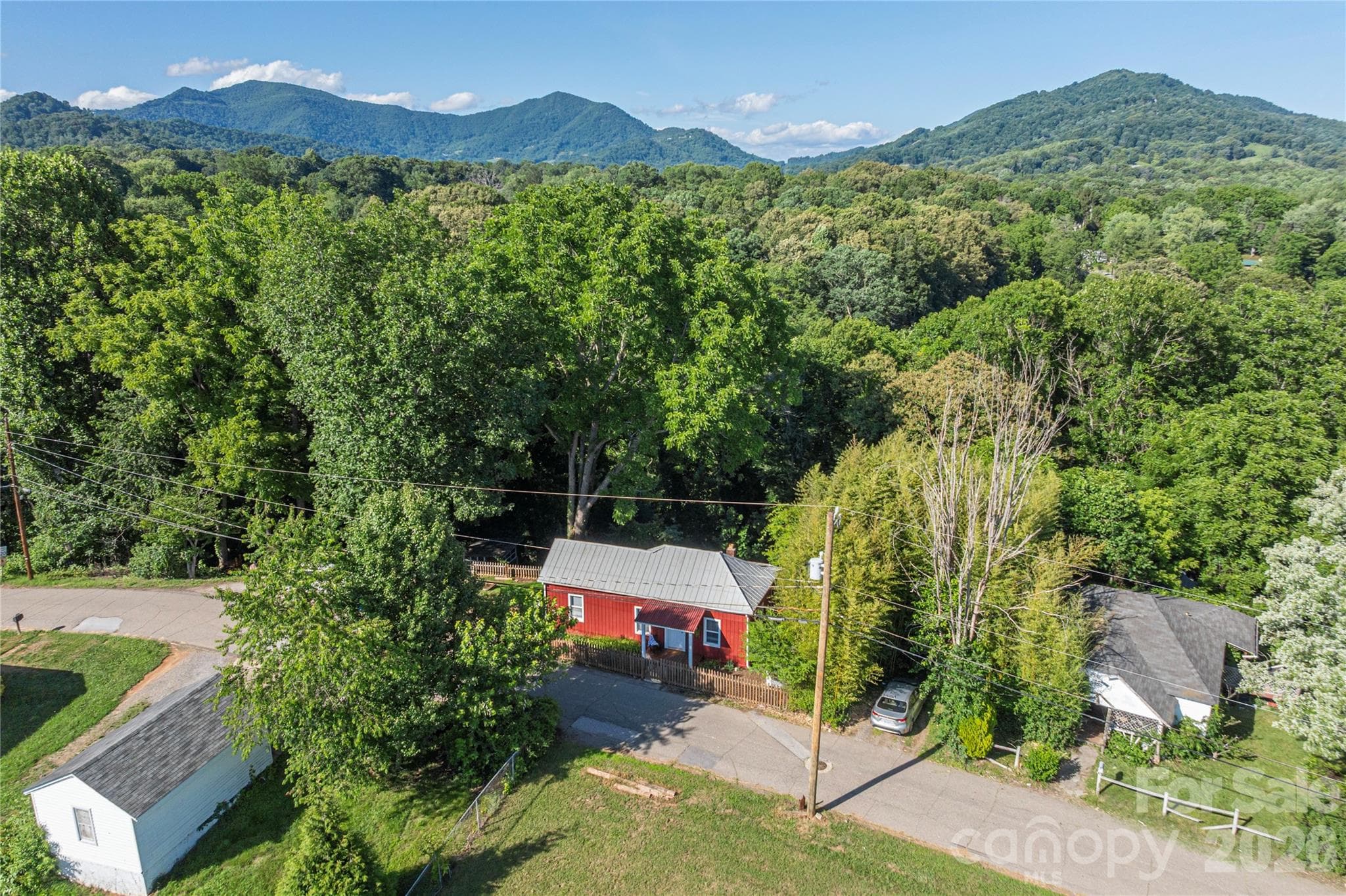 Aerial view showcasing the home's mountain setting and surrounding landscape. - 261 Star Ridge Road, Canton