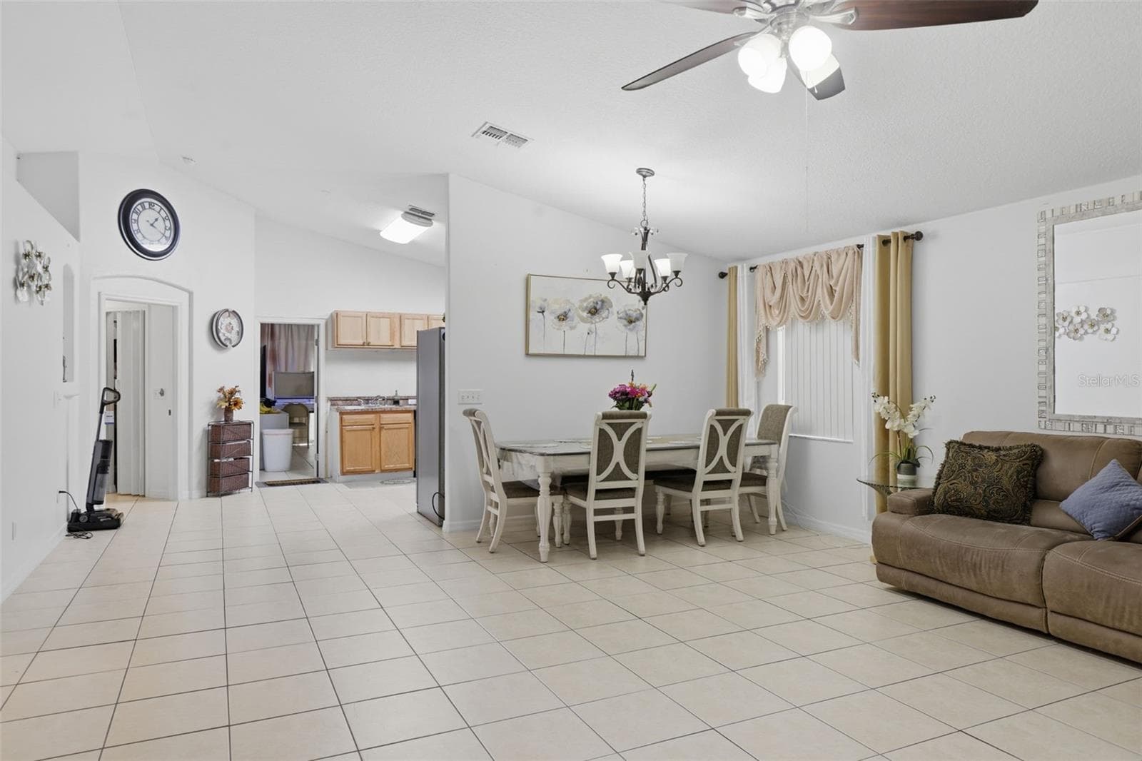 Open concept - dining and living room with elevated ceilings - 1911 S GADSEN BLVD, ORLANDO