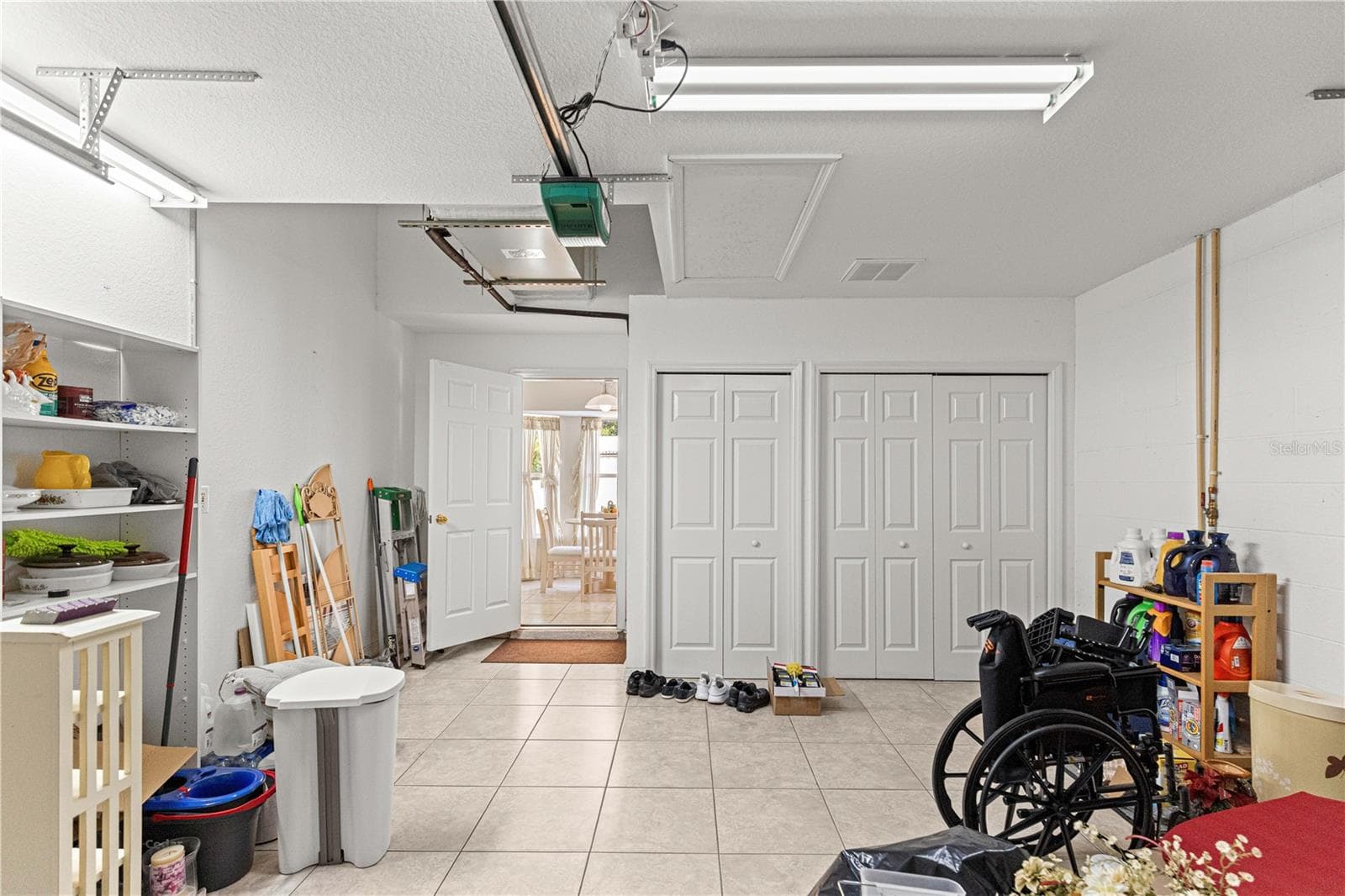 garage with closet for laundry and well - 4 CEDAR TRACE PASS, OCALA