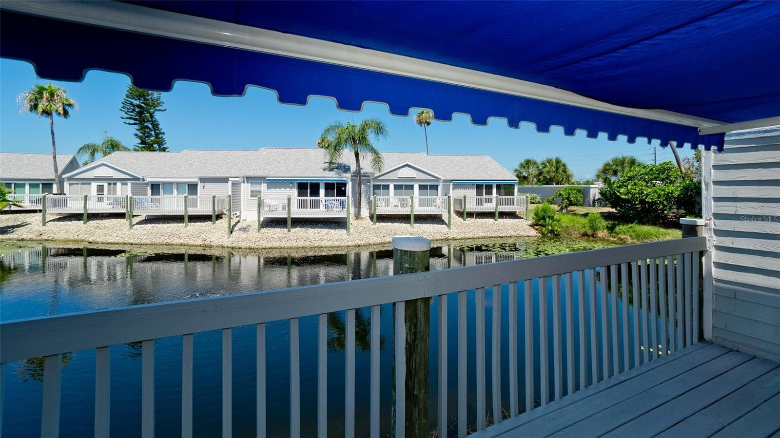 ELECTRIC AWNING OVER DECK - 506 WOODSTORK CIR, BRADENTON