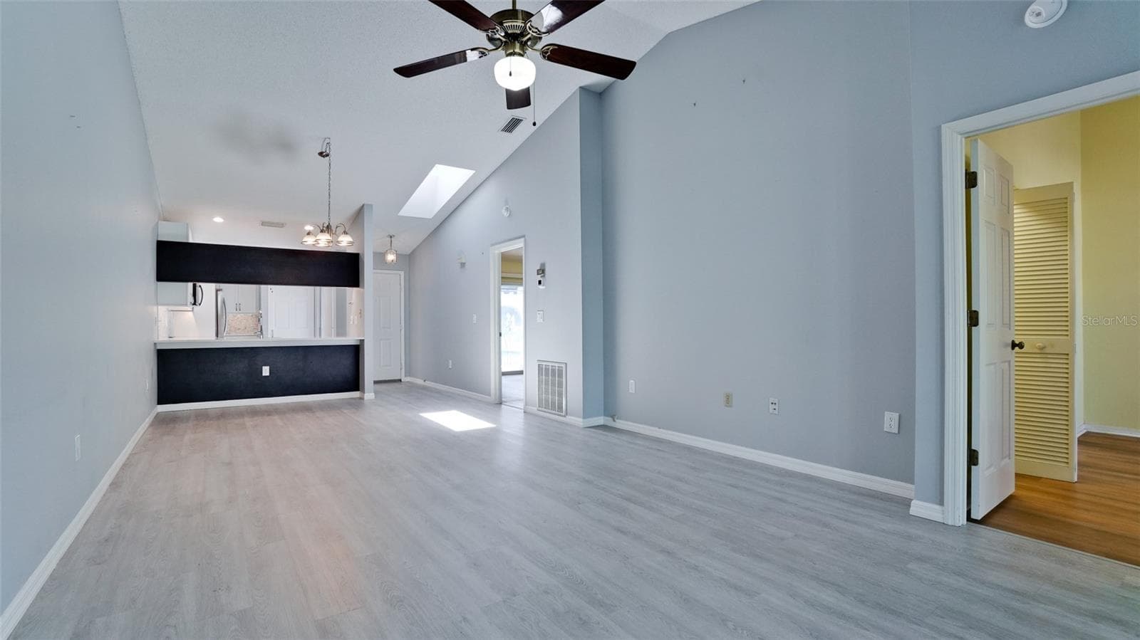 LUXURY VINYL FLOORING THROUGHOUT VILLA GREAT ROOM - 506 WOODSTORK CIR, BRADENTON