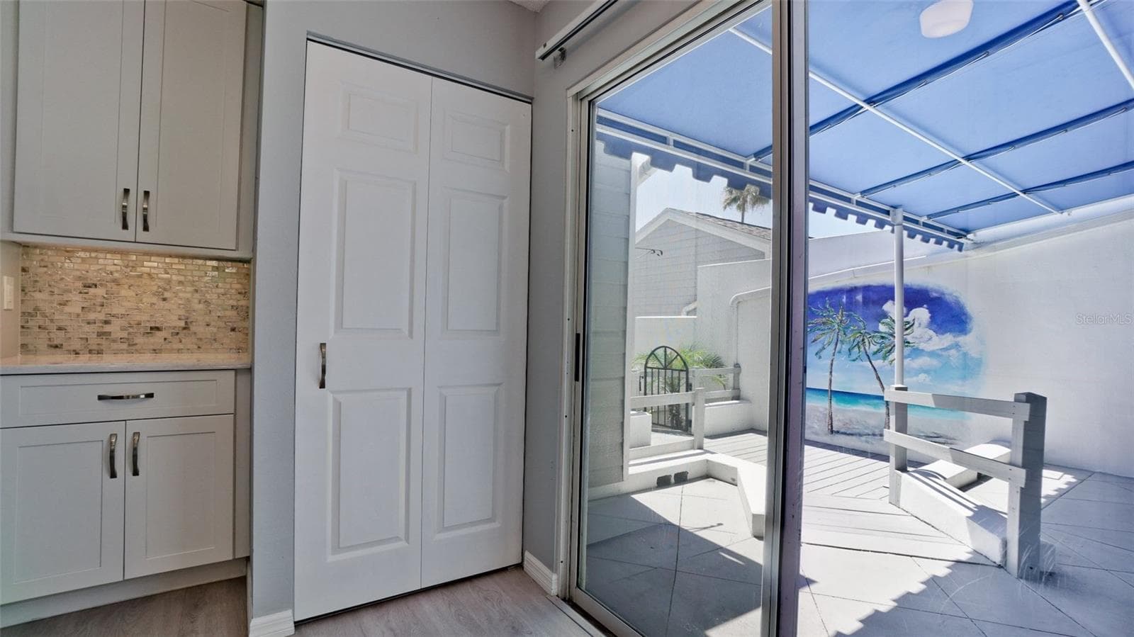 SLIDERS LEADING TO ENTRY COURTYARD - 506 WOODSTORK CIR, BRADENTON