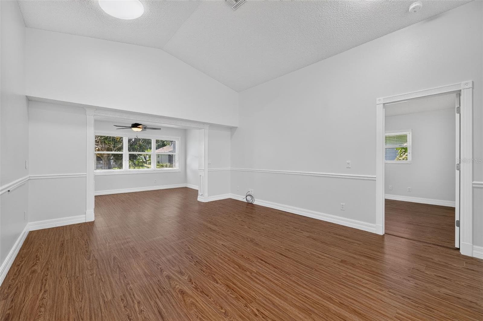 Bonus Room is off the Living Room; Primary Suite is through the door on the right - 4431 FERN DR, BRADENTON