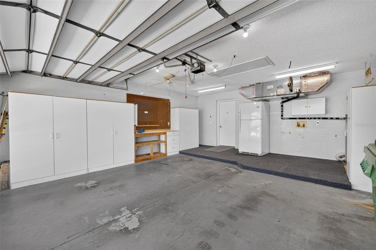 Garage with Workbench and Extra Storage - 4431 FERN DR, BRADENTON