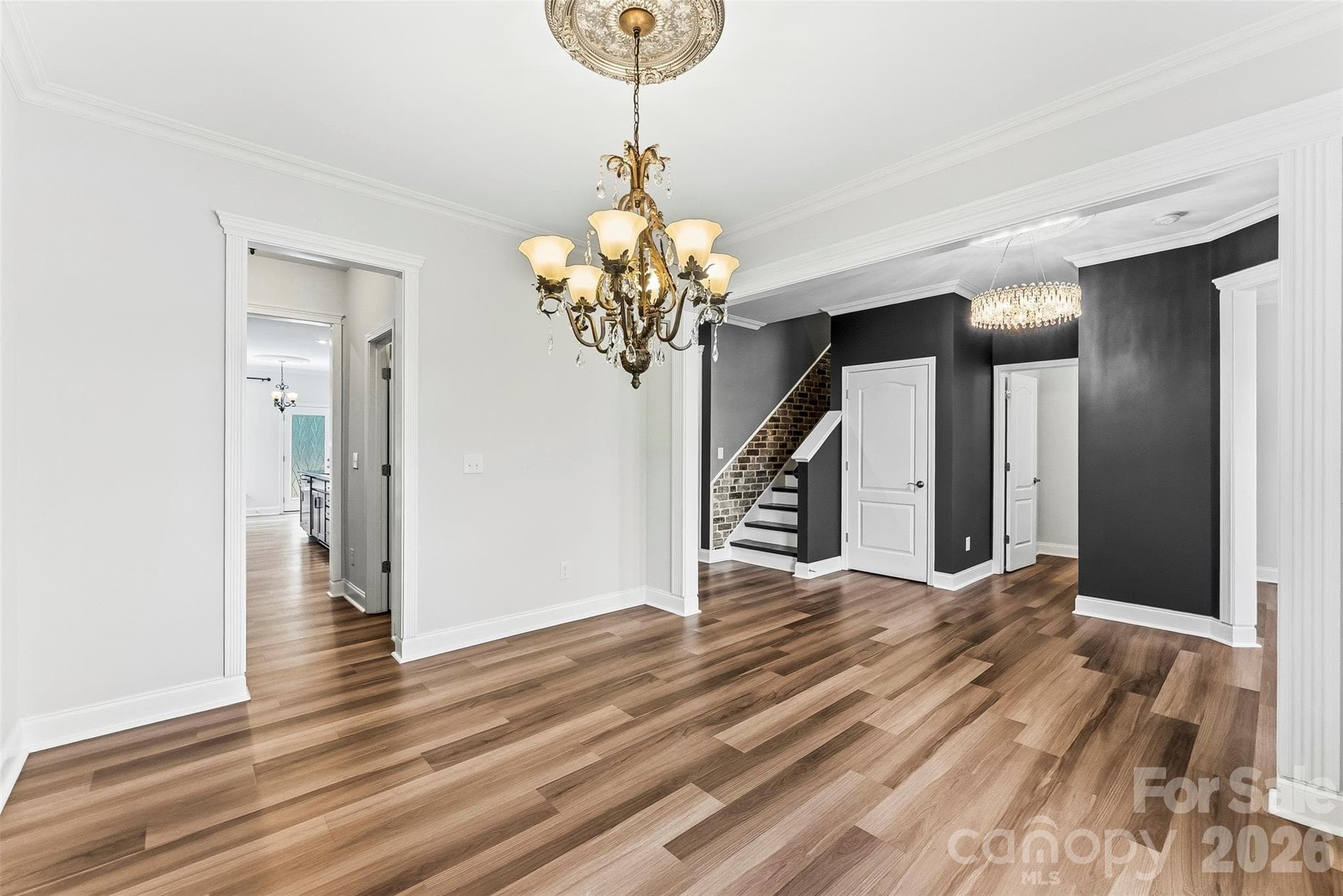 Another view of the well appointed Dining Room which can be a flex room as well.  Freshly painted, upgraded lighting and beautiful flooring. - 1318 Poppy Way, Matthews