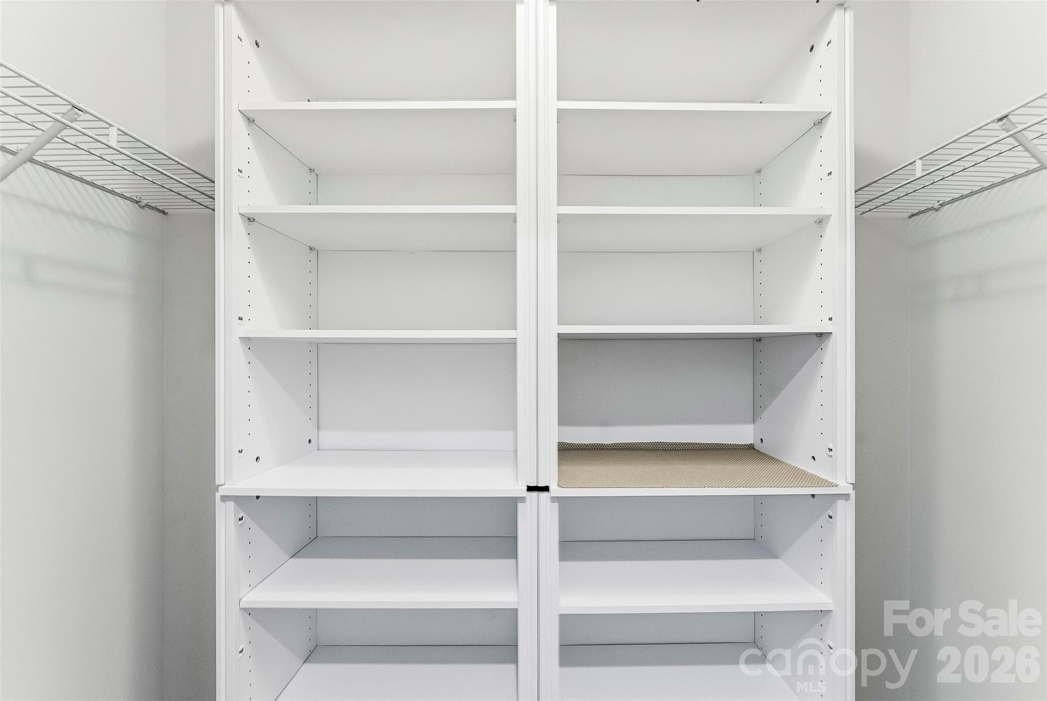 Second Closet in the Primary Bedroom]features built in's - 1318 Poppy Way, Matthews