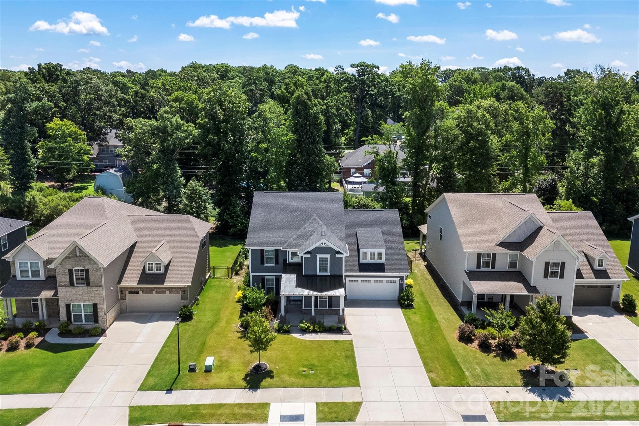 Aerial View of this home.  Trees line the back of the property giving a nice buffer for privacy. - 1318 Poppy Way, Matthews