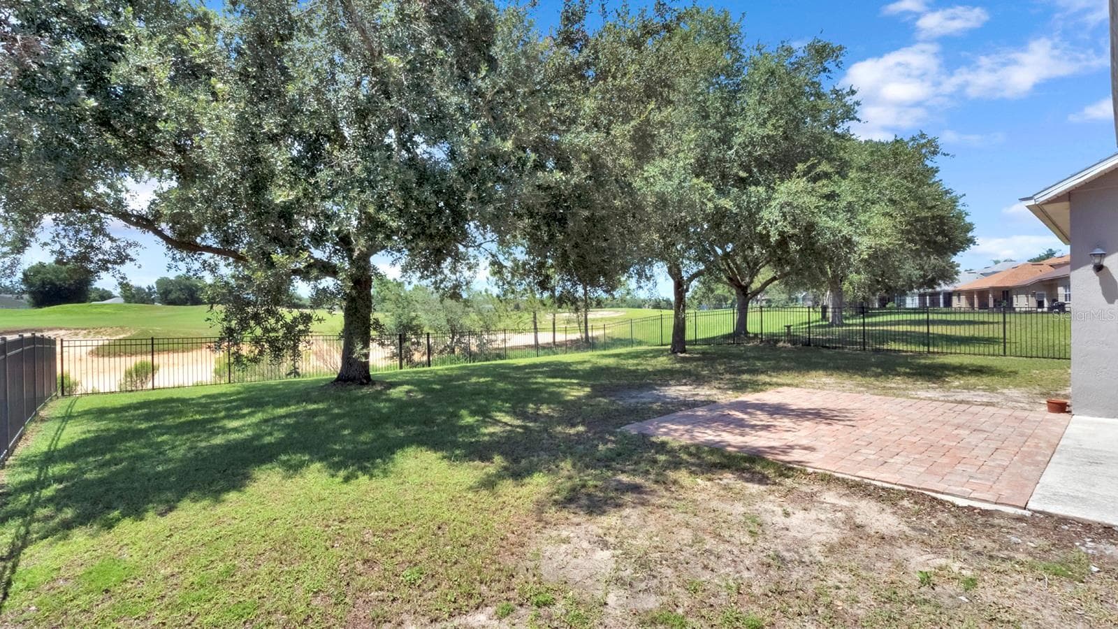 View to the Eagle Dunes Golf Course from the back of the home. - 34037 FORTUNADO ST, SORRENTO