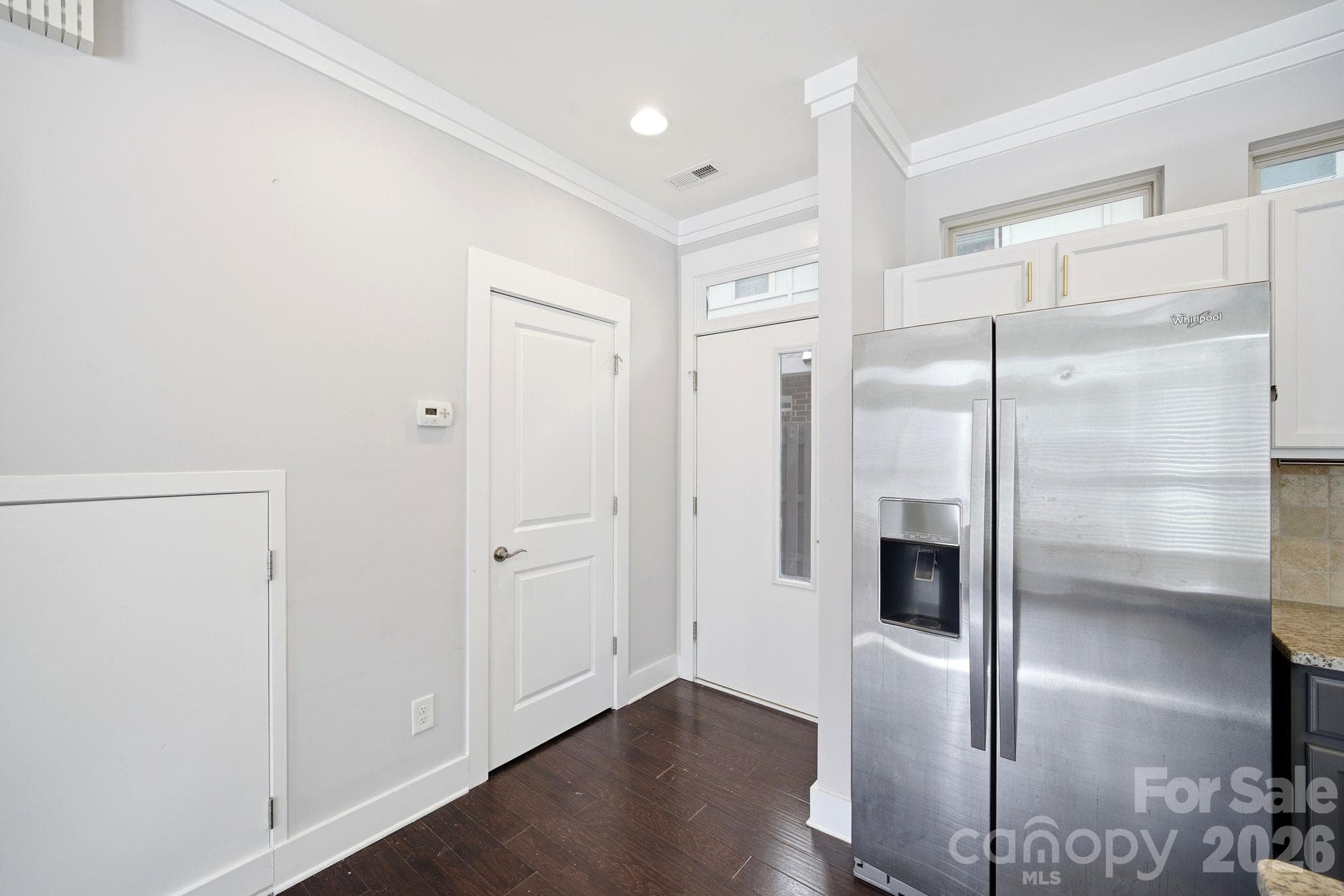 Kitchen leading to 1/2 bath and patio door - 923 Warren Burgess Lane, Charlotte