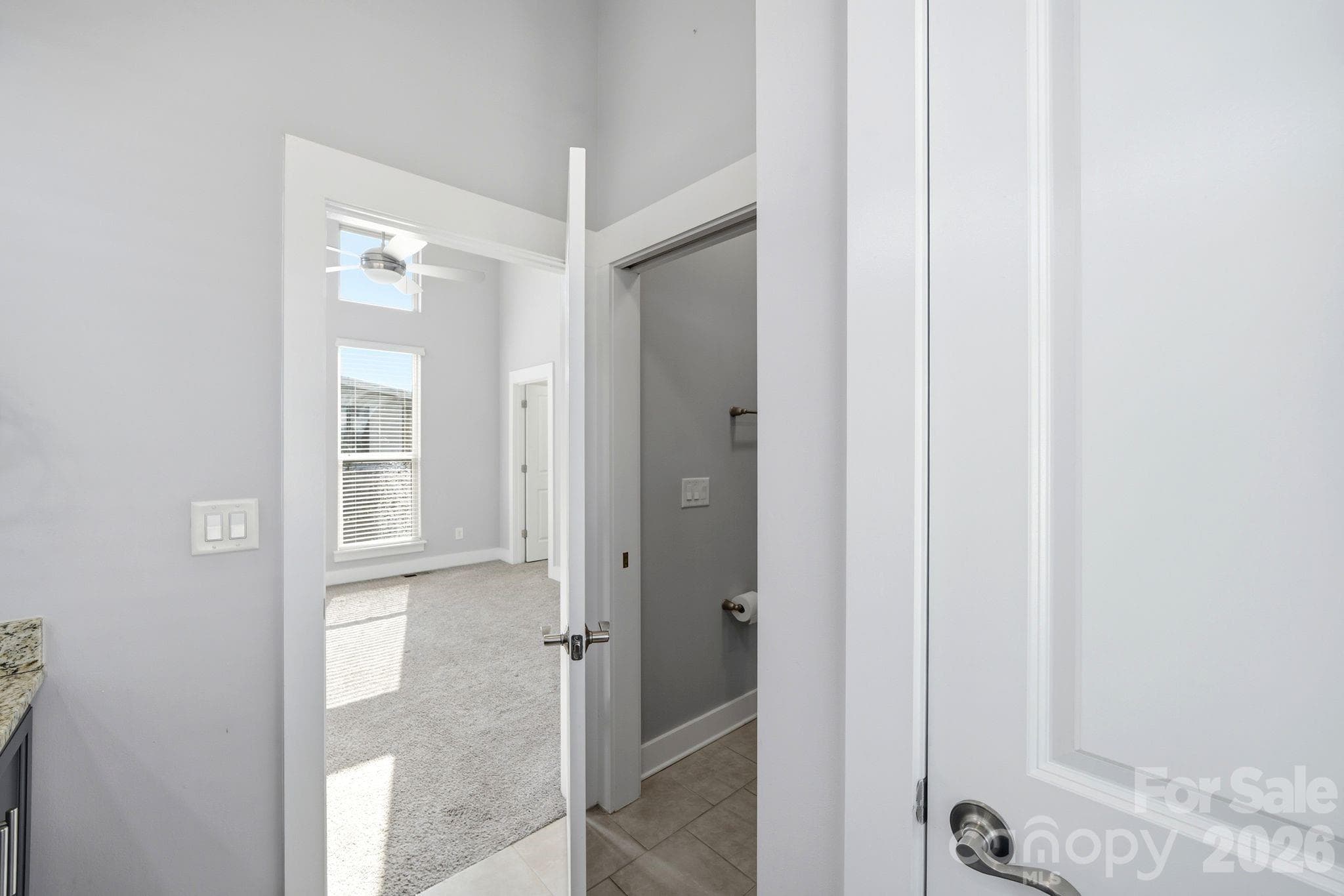 Primary en-suite bath with pocket door for private toilet - 923 Warren Burgess Lane, Charlotte