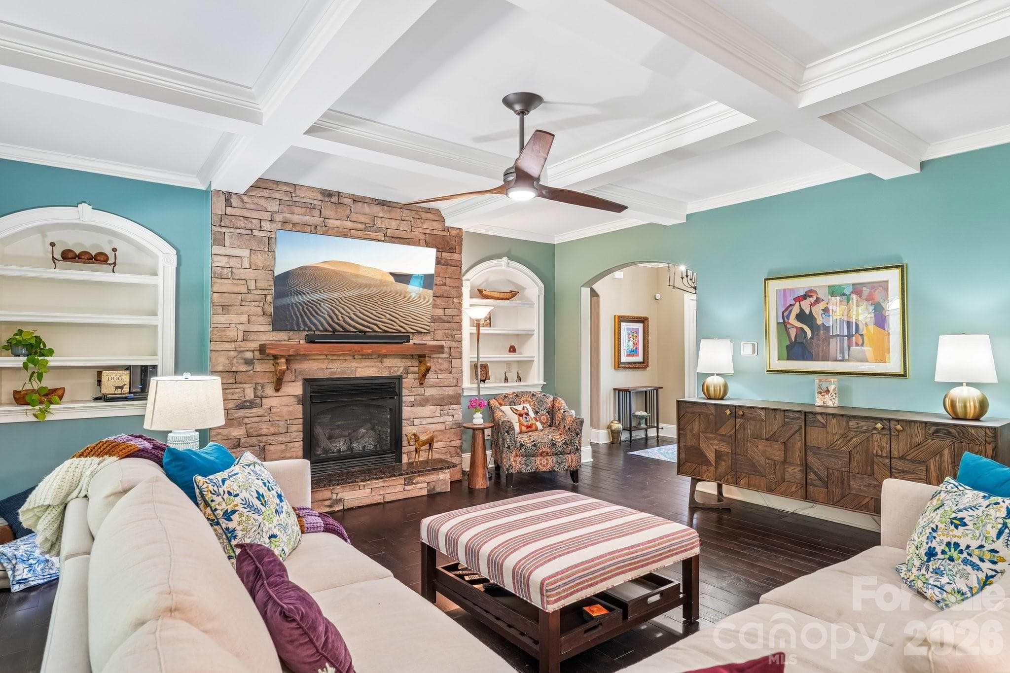 custom trim, and a striking stacked-stone gas fireplace - Charlotte