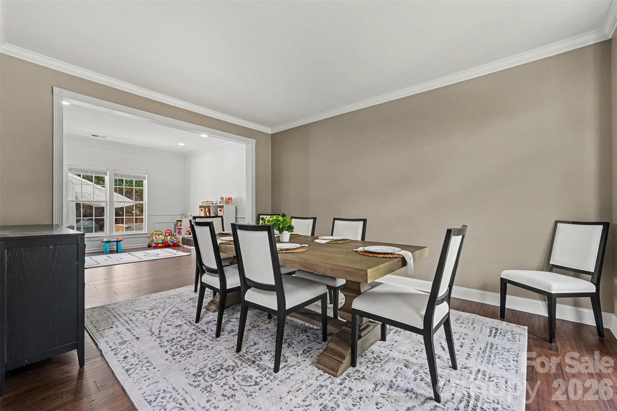 Formal living room is located to the right of the front door as you enter. Currently used as a dining room as seller is using dining area as a playroom area. So much you can do with the space! - 2442 Smith Cove Road, Denver