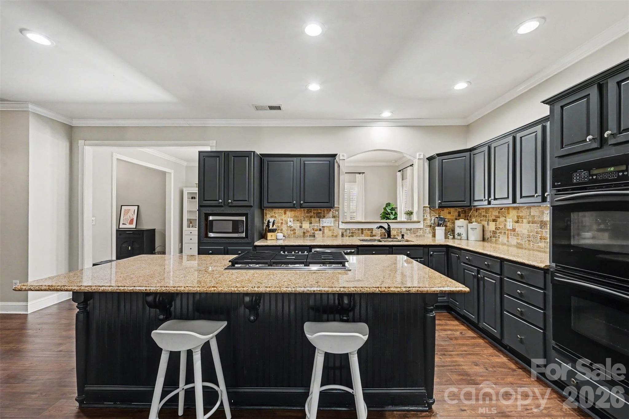 Large kitchen with see through pass way into another dining area or flex space. Double ovens and gas cook top ready for the chef! - 2442 Smith Cove Road, Denver