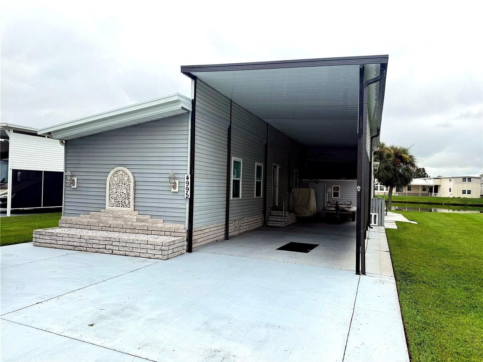 Manufactured Home at 4995 MOUNT OLIVE SHORES DR, POLK CITY, photo 2 of 75