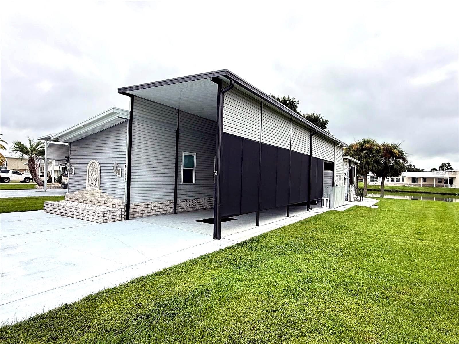 Manufactured Home at 4995 MOUNT OLIVE SHORES DR, POLK CITY, photo 3 of 75