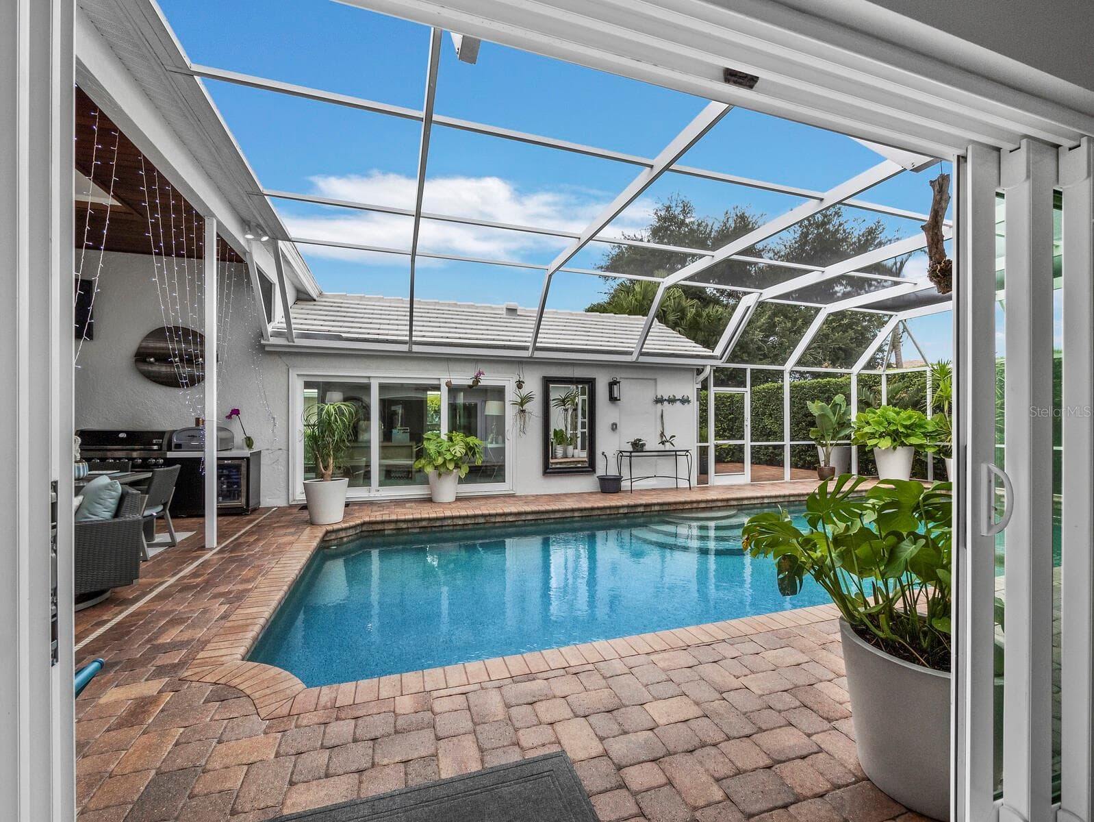pool view from kitchen/Dining room - 206 FOUR KNOT LN, OSPREY
