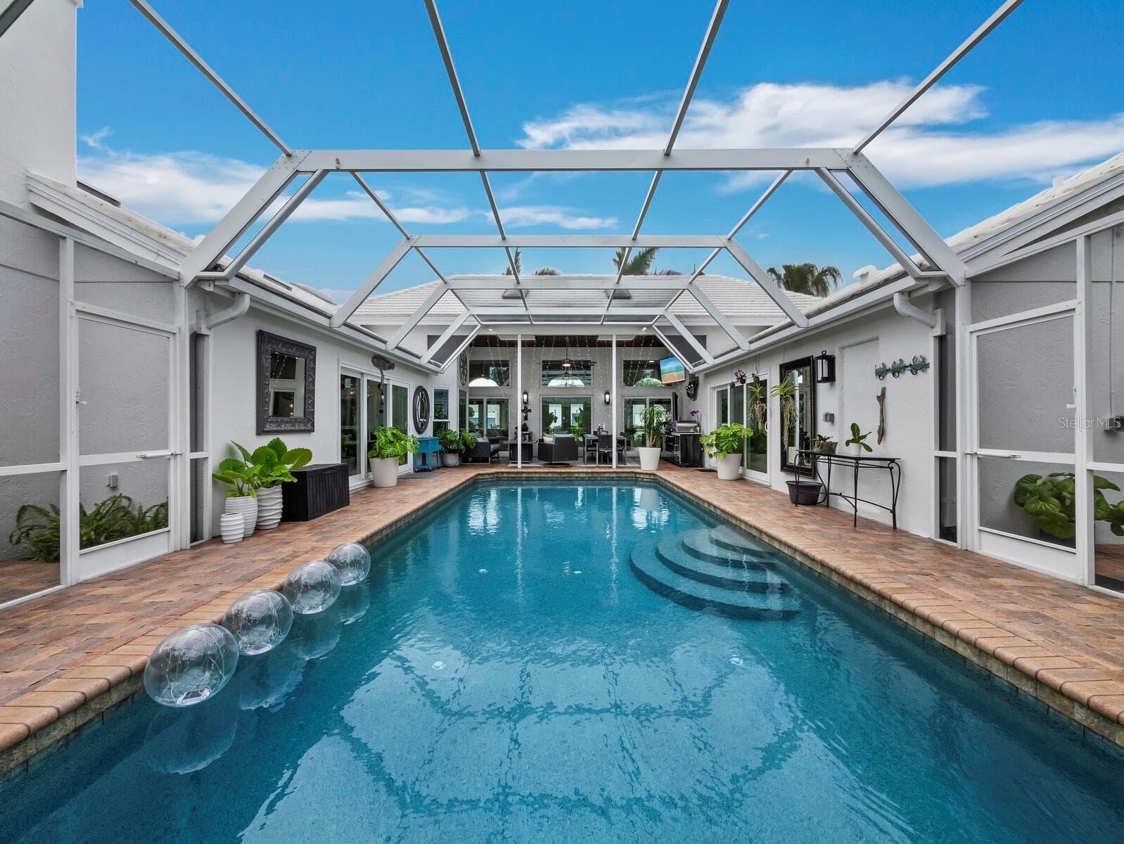 Pool view looking south - 27’ x 14’ for pool dimensions - 206 FOUR KNOT LN, OSPREY