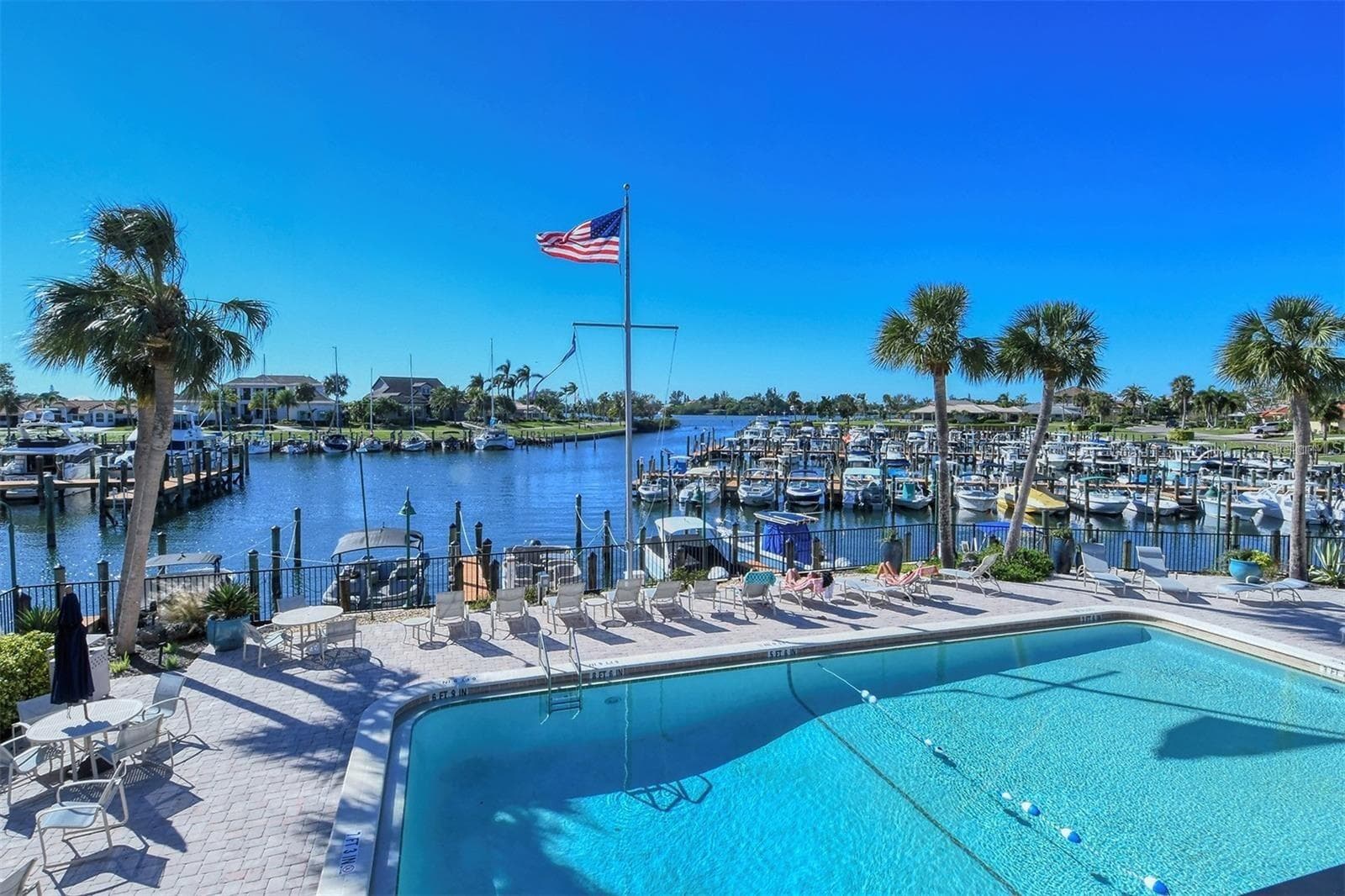 SBYRC clubhouse heated pool looking west out to the marina - 206 FOUR KNOT LN, OSPREY