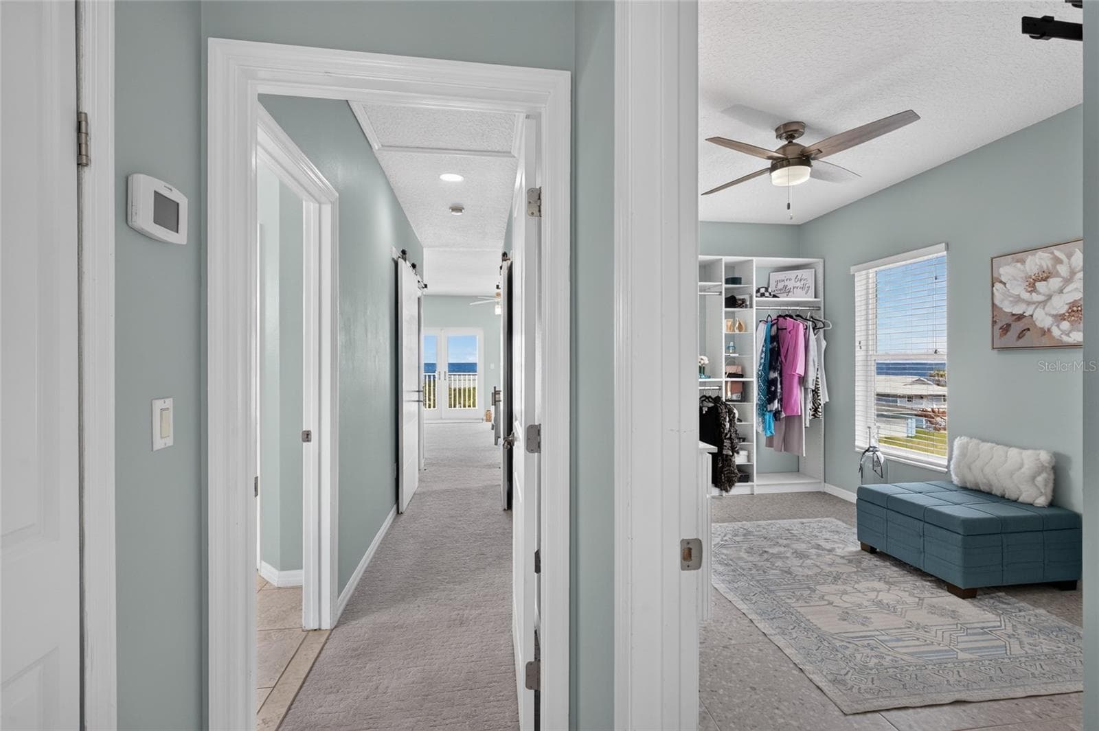 ENTRY TO PRIMARY BEDROOM - GUEST ROOM #1 ON RIGHT MAY ALSO BE USED AS A PRIMARY DRESSING ROOM - 1955 N CENTRAL AVE, FLAGLER BEACH