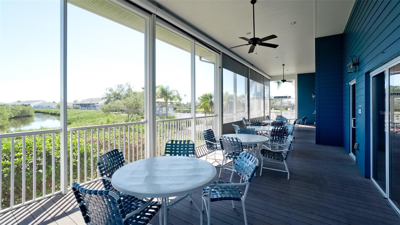 OUTDOOR PORCH FOR ACTIVITIES IN THE CLUBHOUSER - 506 WOODSTORK CIR, BRADENTON