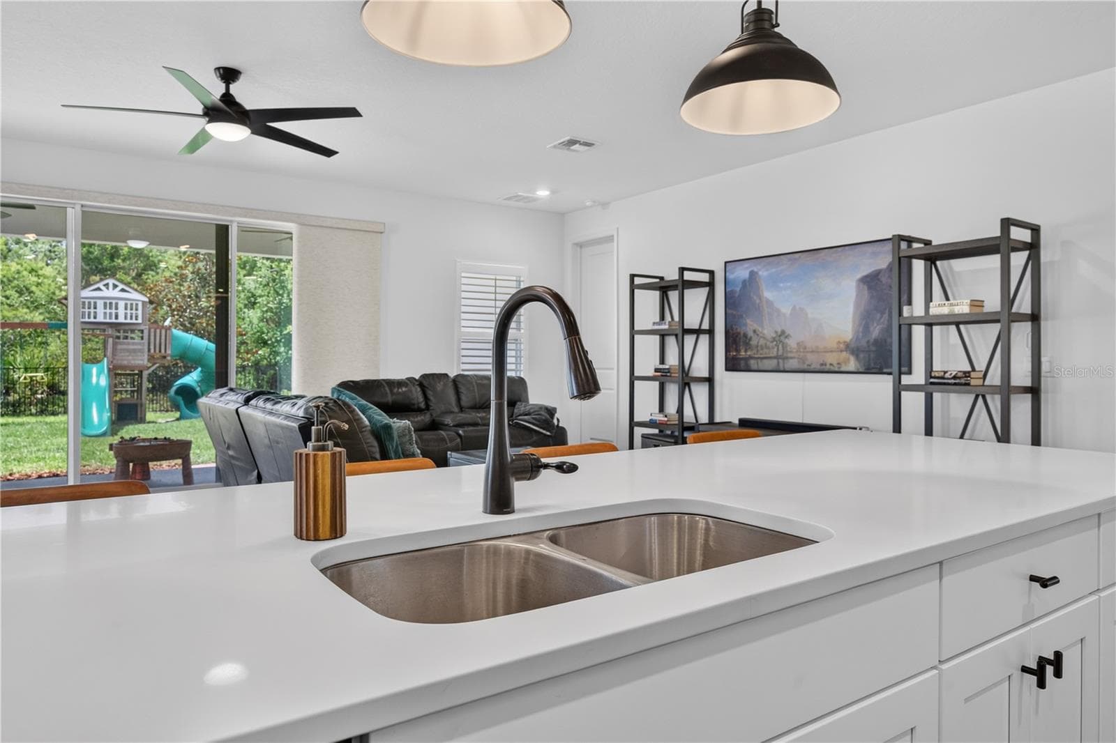 View of the Living Area from the Kitchen - 1113 PEARL TREE RD, DELTONA