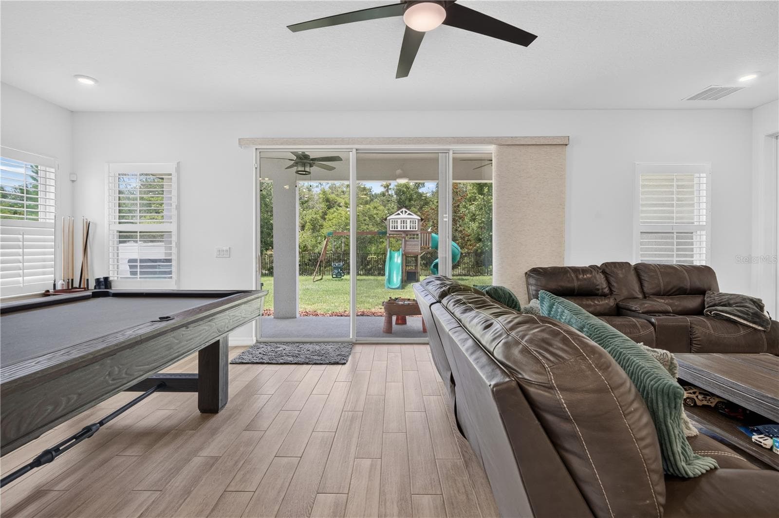 Living Area with the view of the backyard - 1113 PEARL TREE RD, DELTONA