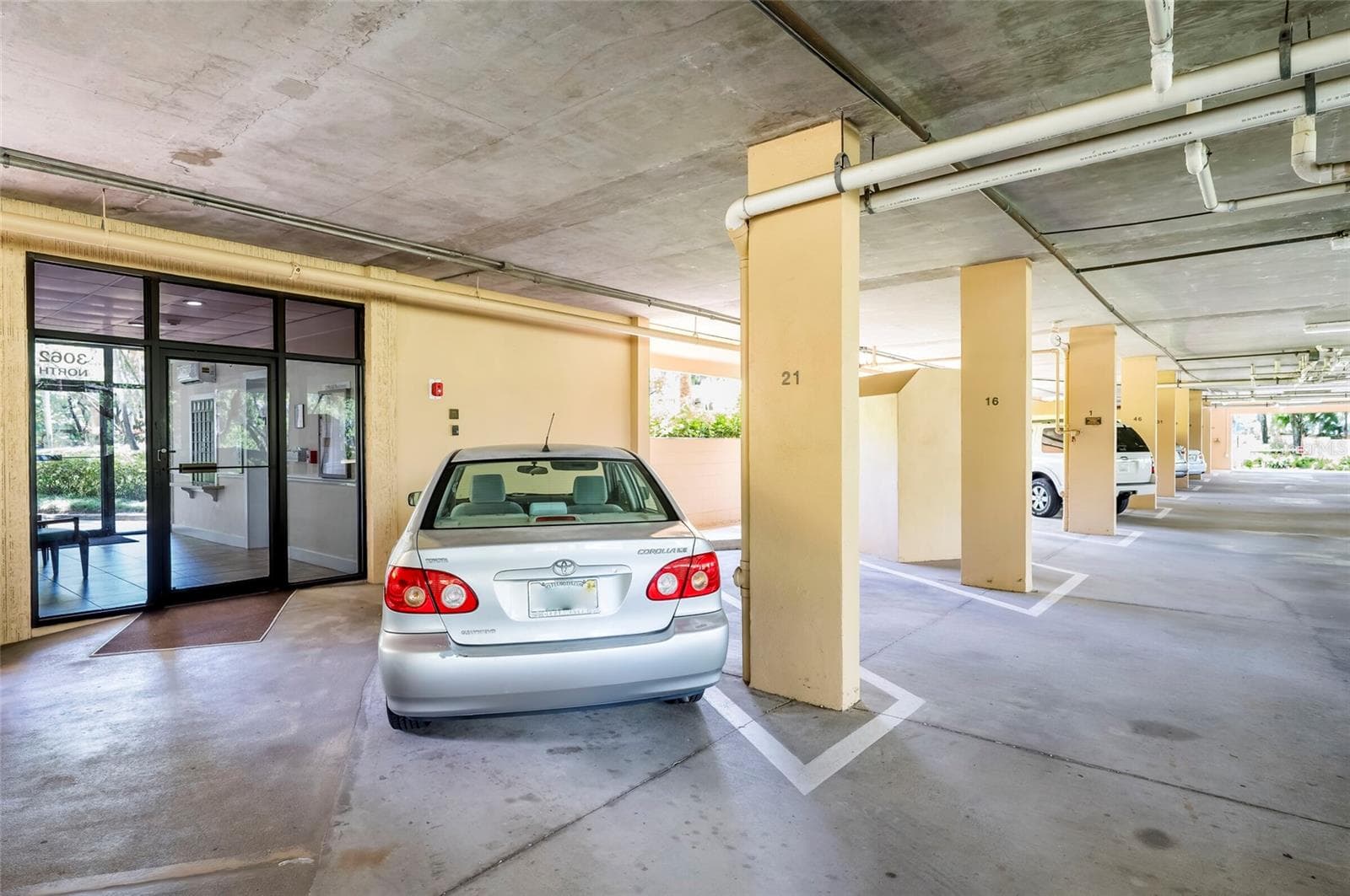 #21 Under building parking right next to lobby door - 3062 EASTLAND BLVD #406, CLEARWATER
