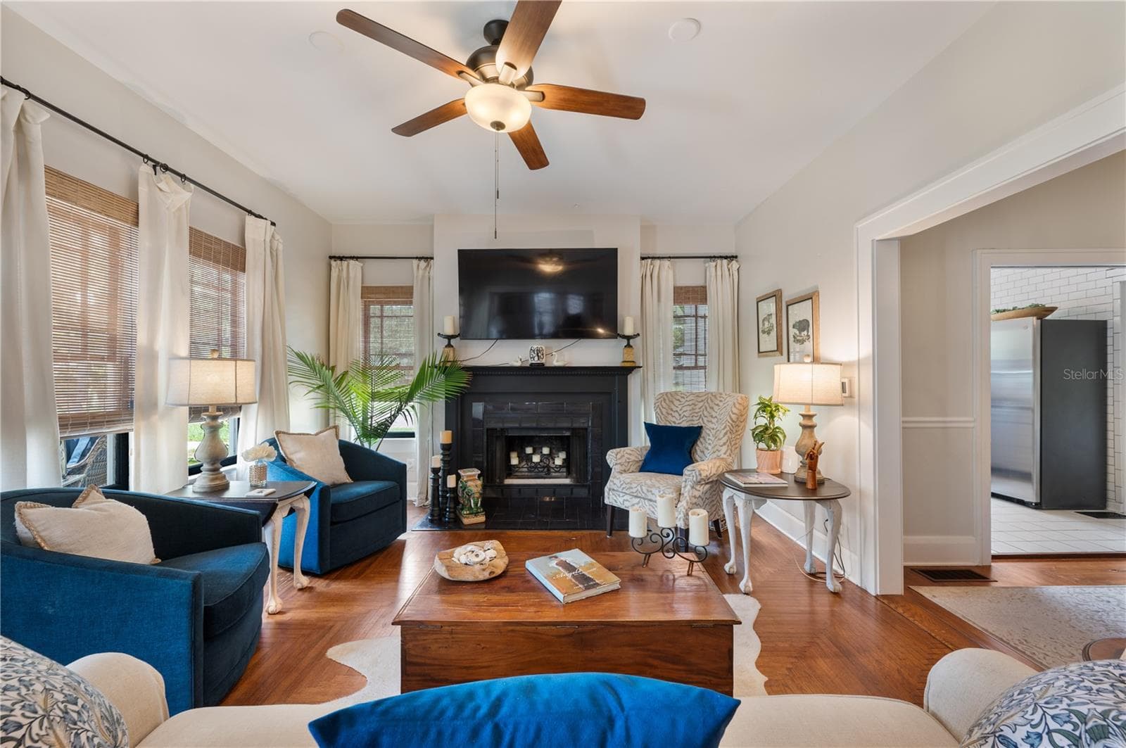 Living room with wood burning fireplace - 1102 MELTON AVE, LAKELAND