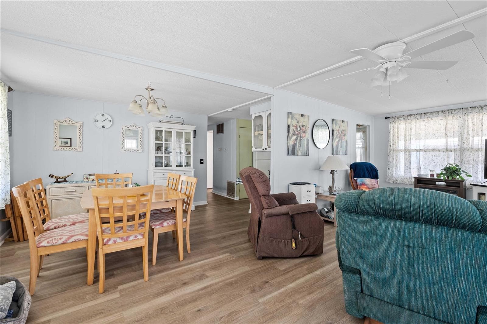 The dining room is just off the kitchen and living room areas - 5301 FLINT ST, ZEPHYRHILLS